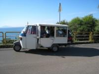 Charter Italien - Taxi zum Flughafen - Ein Dreirad mit 7 Sitzen und Gepäckabteil
